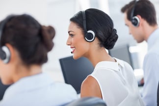 Three call centre employees working in line